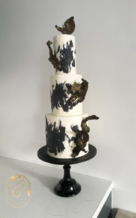Black and White Abstract Modern Wedding Cake. Three tier wedding cake with modern rice paper decorations