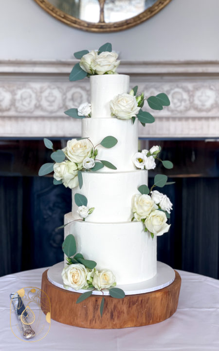 Four Tier classic wedding cake with white roses