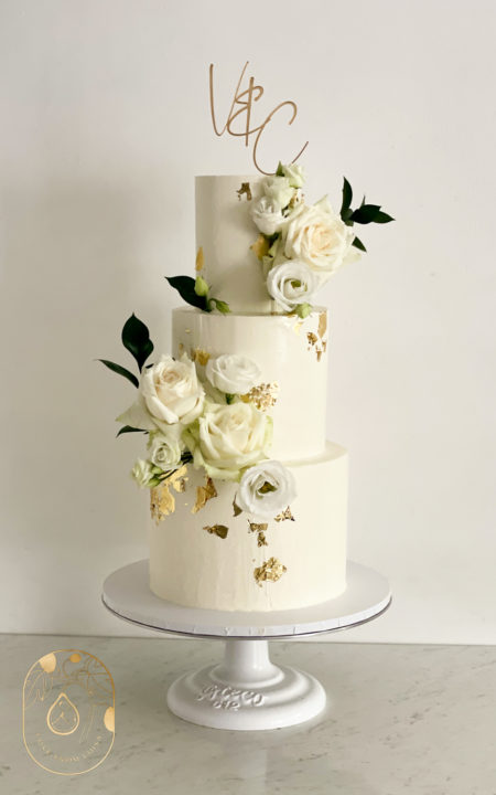 Classic white and gold wedding cake with gold acrylic cake topper