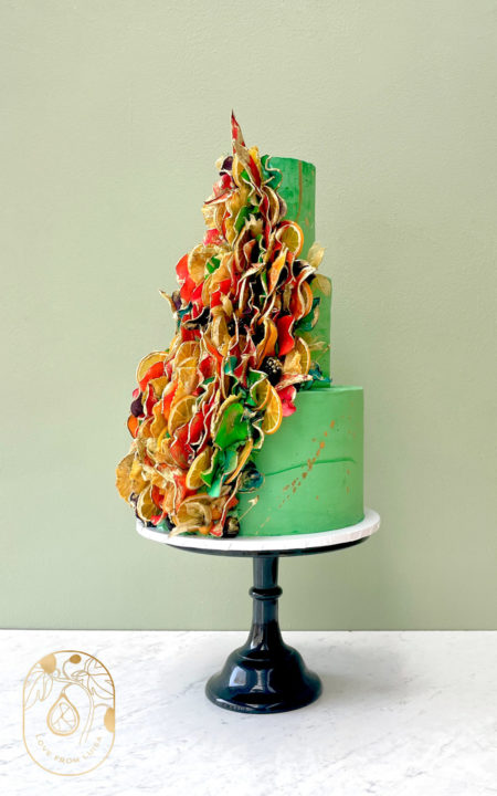 Green and Gold Three Tier Wedding Cake with Luisa's signature Fruit Petal Twist