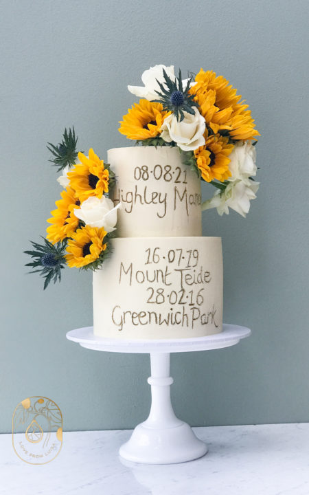 Sunflower and white rose 2 tier Wedding Cake with significant dates written in gold