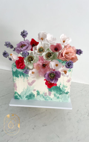 Green and Purple Buttercream Painted Square Wedding Cake with handmade Wafer Paper Flowers
