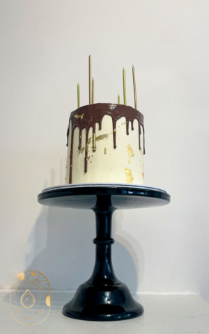 Chocolate drip Birthday Cake with gold leaf and tall gold candles