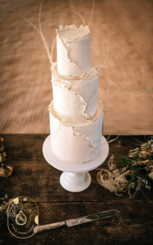 Vegan Three tier Modern Kintsugi Fondant Wedding Cake with white wrapped fondant and gold edge details