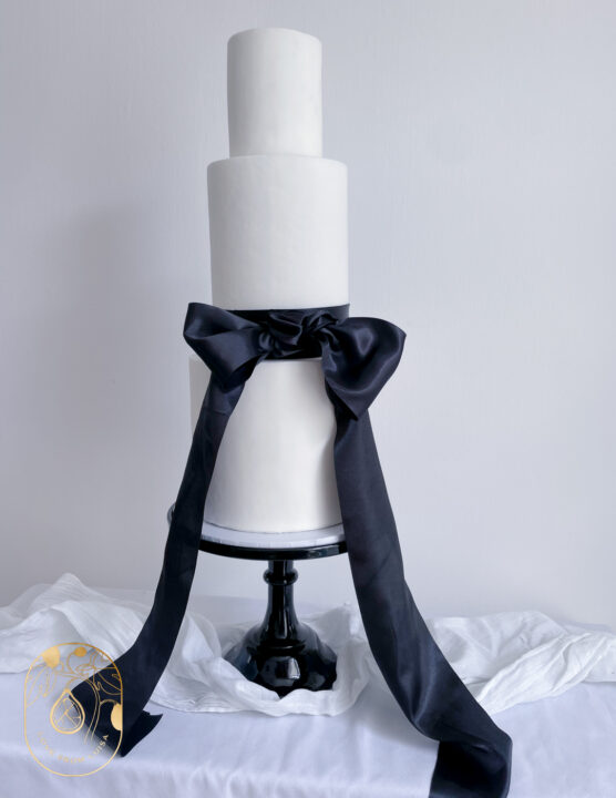 Smart black bow wedding cake