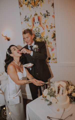 Cake Cutting Photo Naomi and Stephen Groom feeding bride cake 