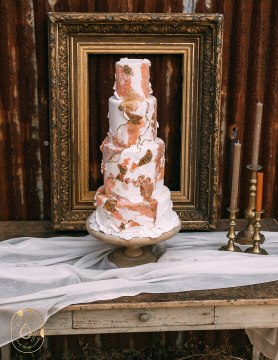Four Tier wedding cake with bronze baroque details