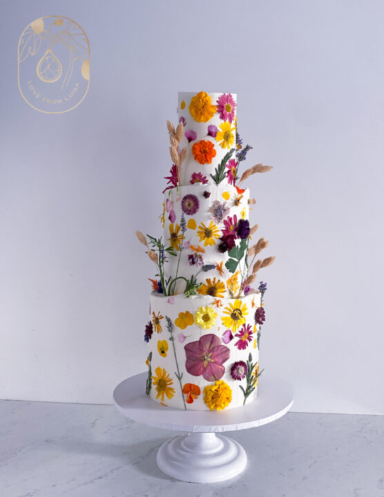 Organic and natural three tier pressed flower wedding cake
