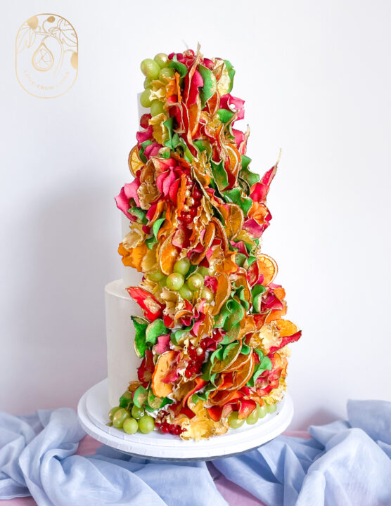 Wedding cake in pinks, green and orange for a fresh spring colour palette. My signature wedding cake style.