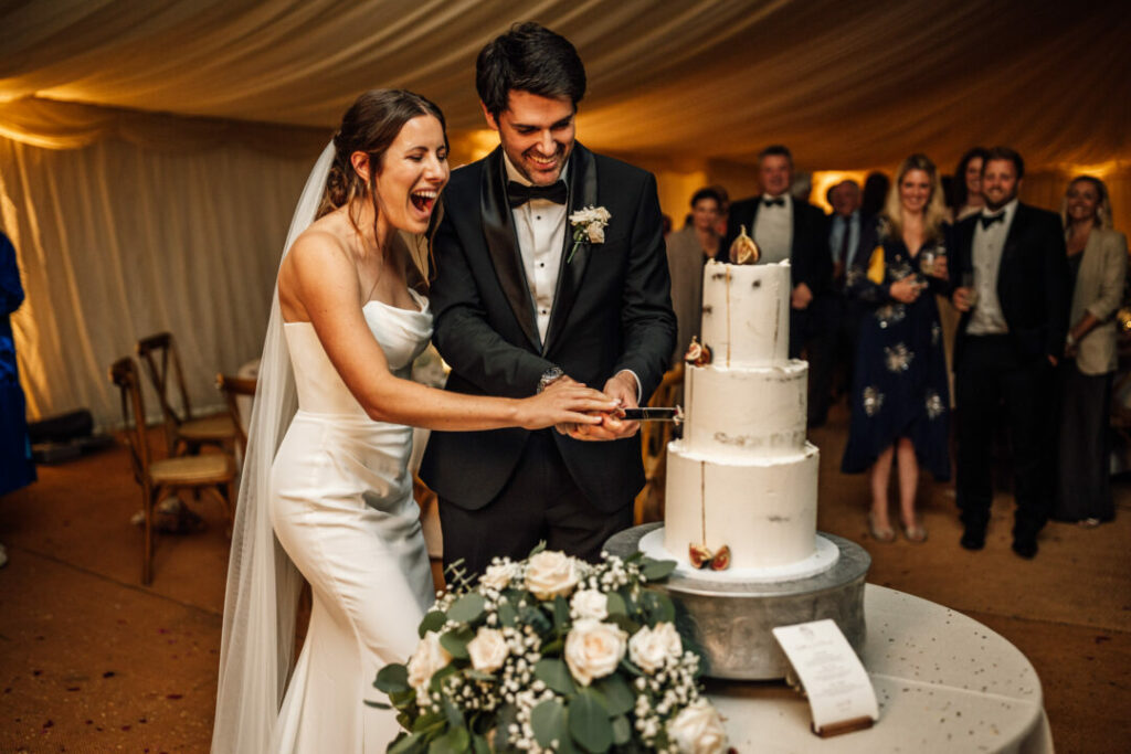 the cake-cutting moment - The couple cutting their wedding cake